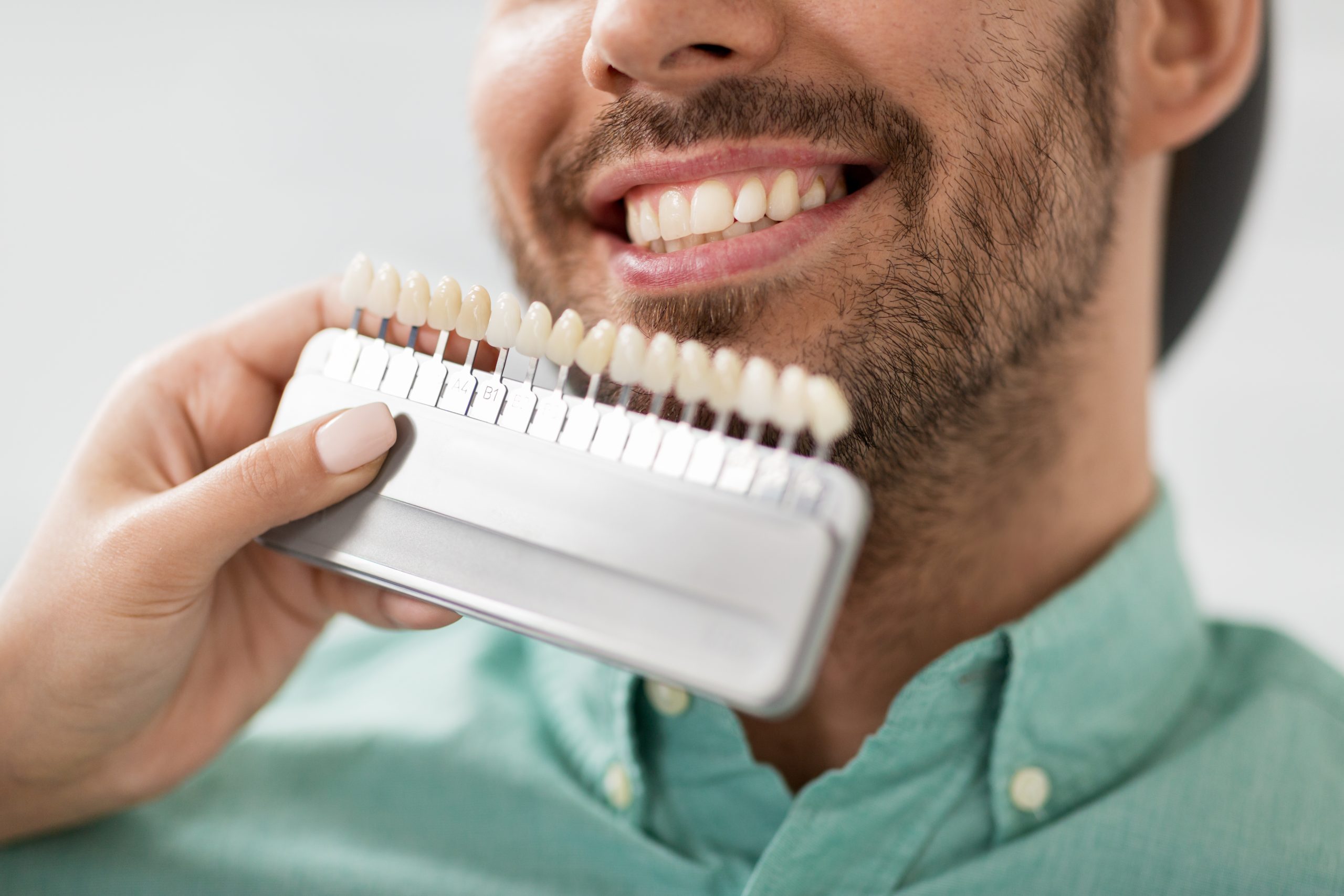 man smiling at scholes family dental during cosmetic dentistry consultation