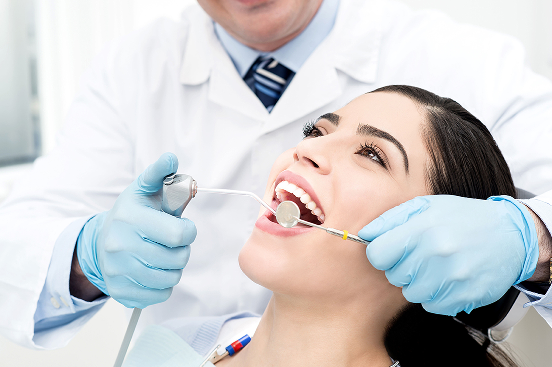 Woman getting a routine teeth cleaning in Coeur d'Alene, ID