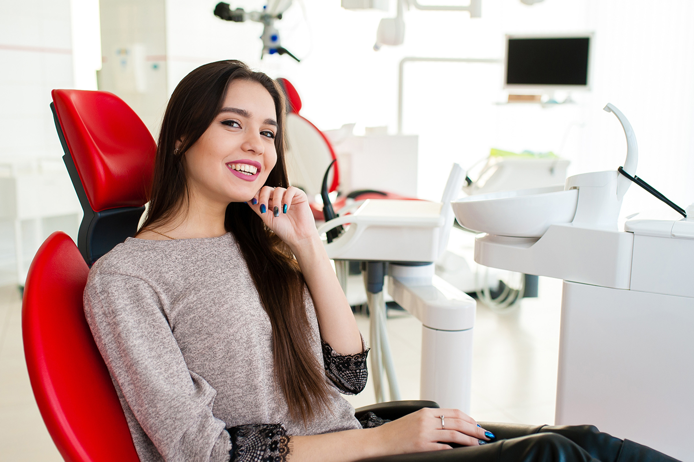 Woman smiling after getting a cosmetic dental treatment in Coeur d'Alene, ID