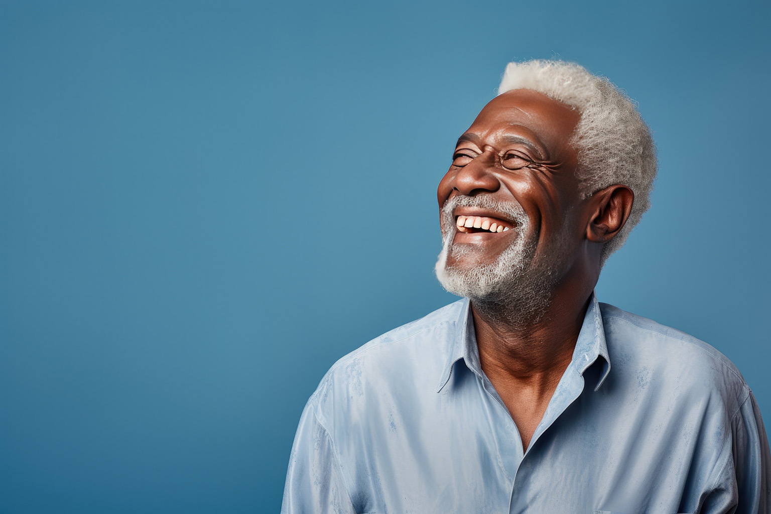 elderly man looking up smiling - Scholes Family Dental